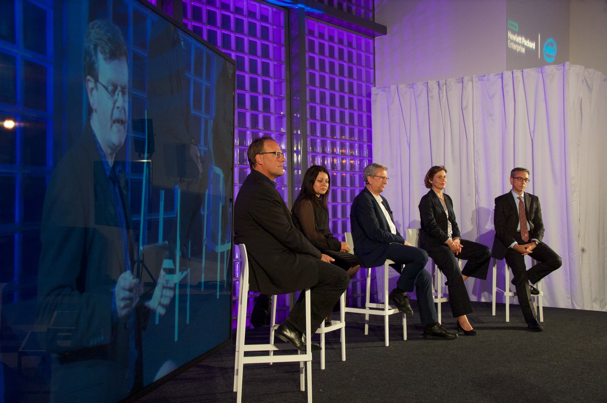 Panel discussion stage for Hewlett Packard Enterprise and Intel event with speakers, presentation screen and corporate event AV production by Bano Event Technology Panel discussion stage for Hewlett Packard Enterprise and Intel event with speakers, presentation screen and corporate event AV production by Bano Event Technology